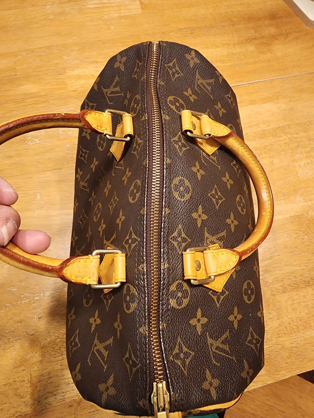 classic Louis Vuitton Monogram Speedy 30 featuring iconic brown coated monogram
